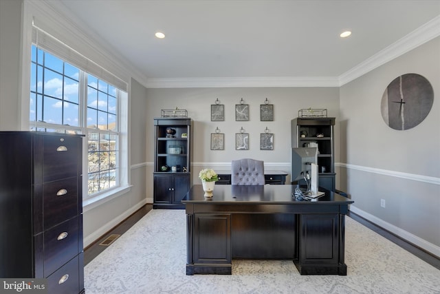 office with plenty of natural light, crown molding, and light hardwood / wood-style flooring