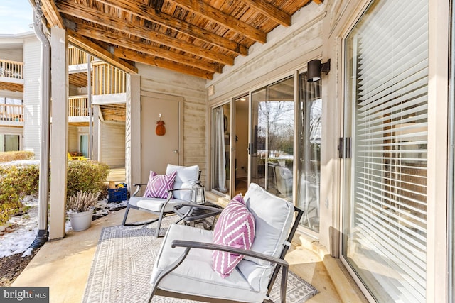 sunroom featuring wood ceiling and beamed ceiling