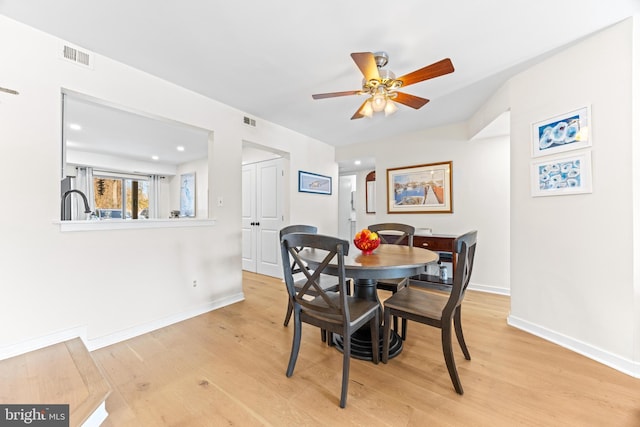 dining room featuring ceiling fan and light hardwood / wood-style floors