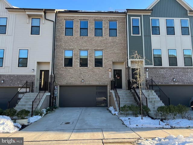 townhome / multi-family property featuring a garage