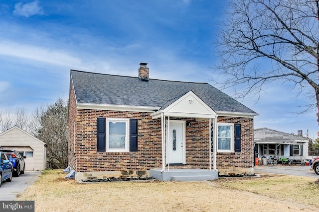 bungalow-style house with a front lawn