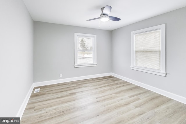 unfurnished room featuring light wood-type flooring and ceiling fan