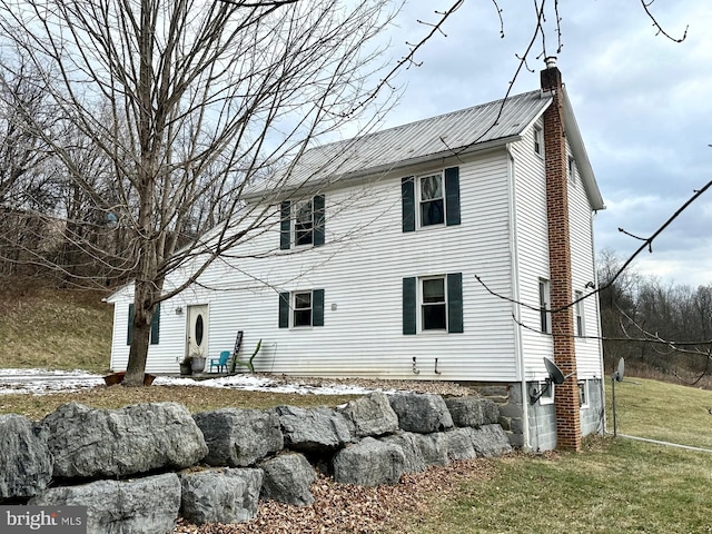 exterior space with a lawn