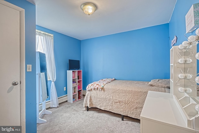 bedroom with light colored carpet and baseboard heating