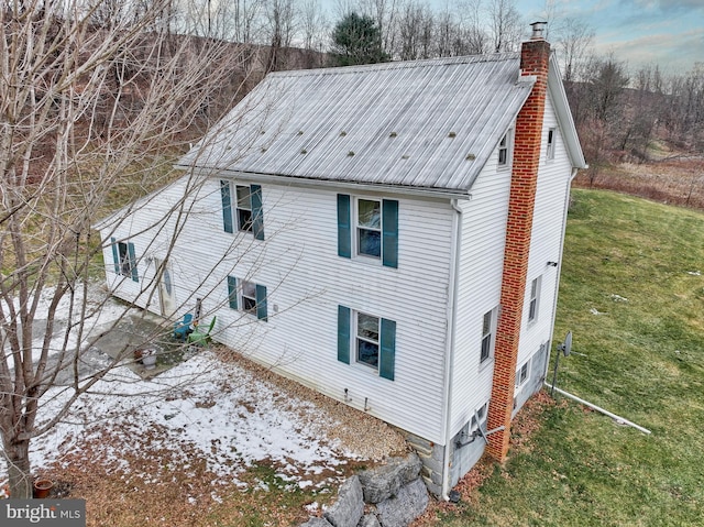 view of home's exterior with a yard