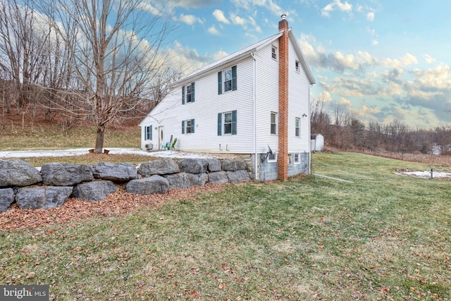 view of home's exterior featuring a lawn