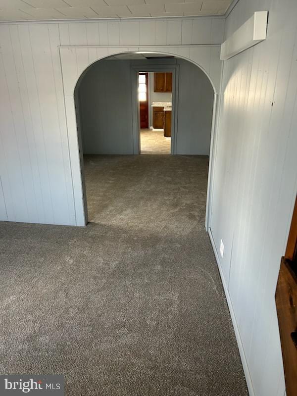 hallway with dark carpet