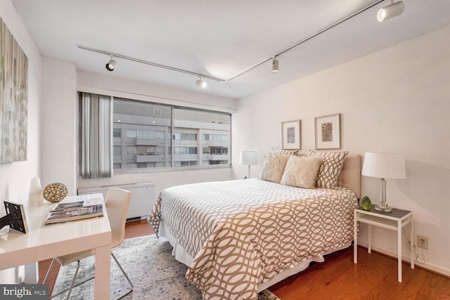 bedroom featuring hardwood / wood-style flooring