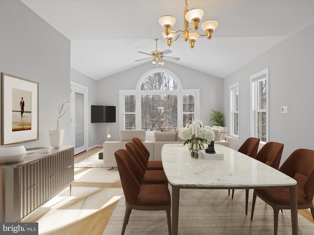 dining room featuring a wealth of natural light, light hardwood / wood-style flooring, a chandelier, and vaulted ceiling