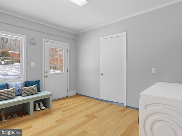 entrance foyer featuring washer / dryer and light wood-type flooring