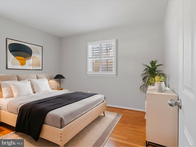 bedroom with light hardwood / wood-style flooring