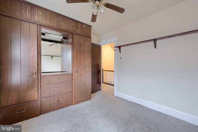 unfurnished bedroom with light carpet and ceiling fan