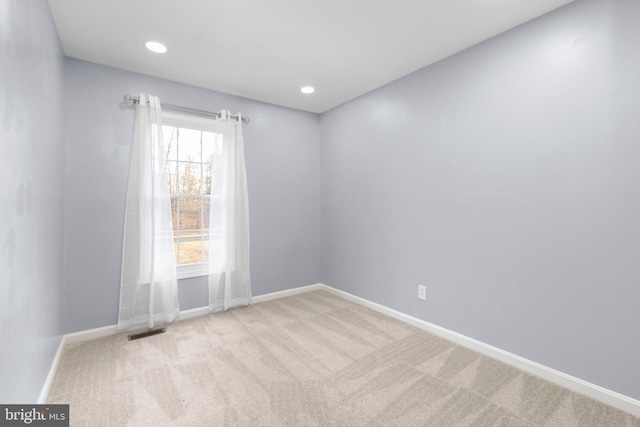 empty room with light colored carpet