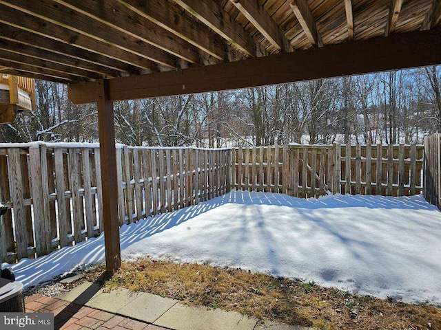 view of yard layered in snow