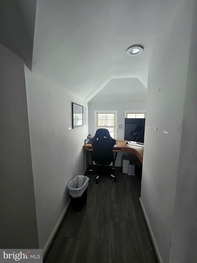 office area with dark hardwood / wood-style floors and lofted ceiling