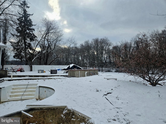 view of yard layered in snow