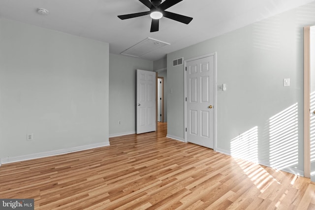 spare room featuring ceiling fan and light wood-type flooring