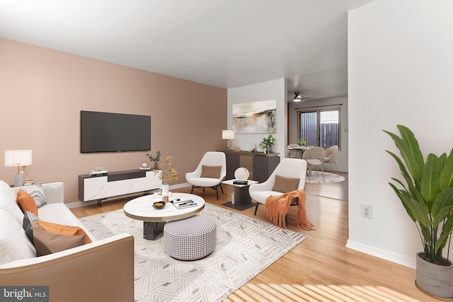 living room featuring light wood-type flooring and ceiling fan