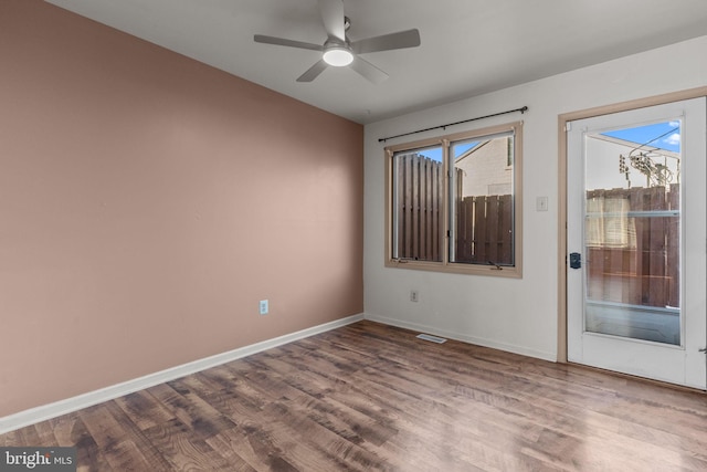 spare room with ceiling fan and hardwood / wood-style floors