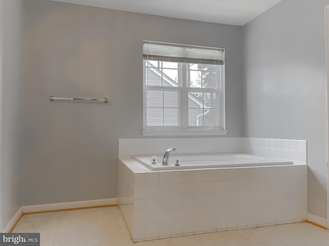 bathroom with tiled bath