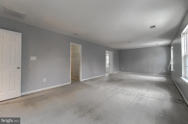 unfurnished room featuring light colored carpet