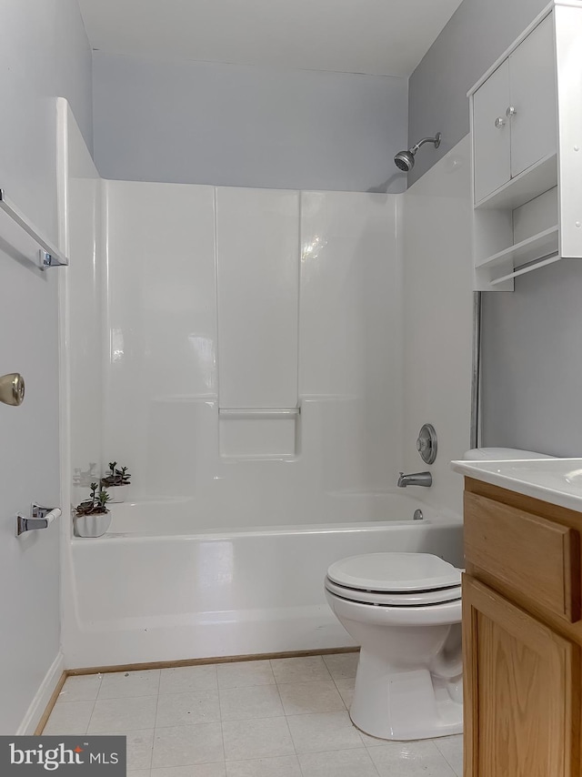 full bathroom with shower / bathing tub combination, toilet, vanity, and tile patterned flooring