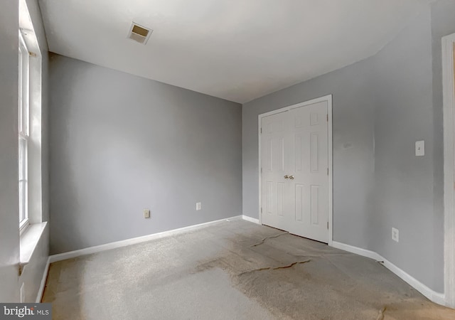 unfurnished bedroom featuring a closet