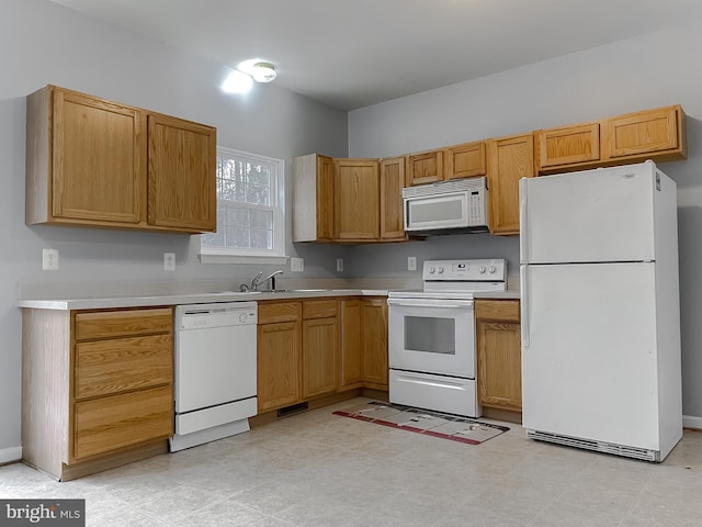 kitchen featuring sink and white appliances