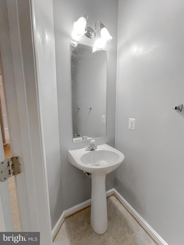 bathroom with tile patterned flooring