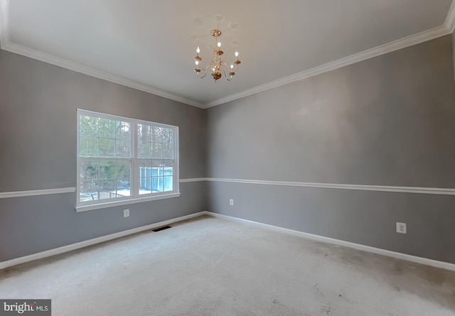 carpeted spare room featuring a notable chandelier and crown molding