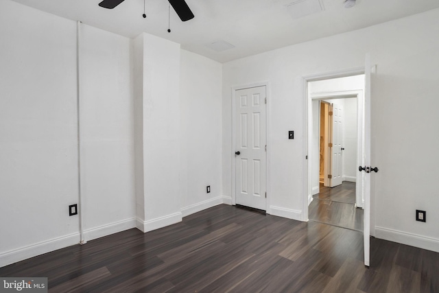 unfurnished room featuring dark hardwood / wood-style floors and ceiling fan