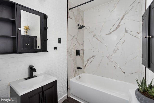 bathroom featuring built in shelves, vanity, and shower / bathtub combination