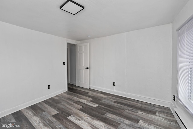 empty room featuring dark hardwood / wood-style floors