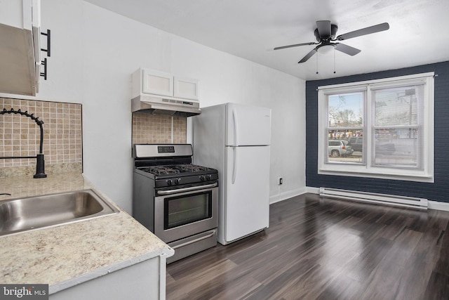 kitchen with tasteful backsplash, baseboard heating, sink, white cabinets, and stainless steel range with gas stovetop