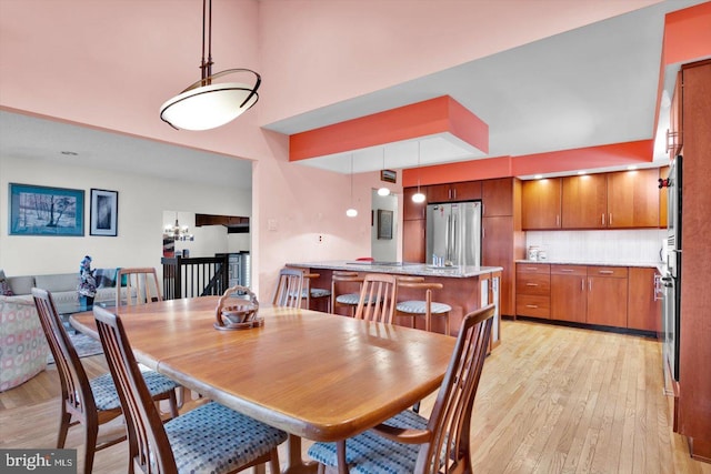 dining space featuring light hardwood / wood-style flooring