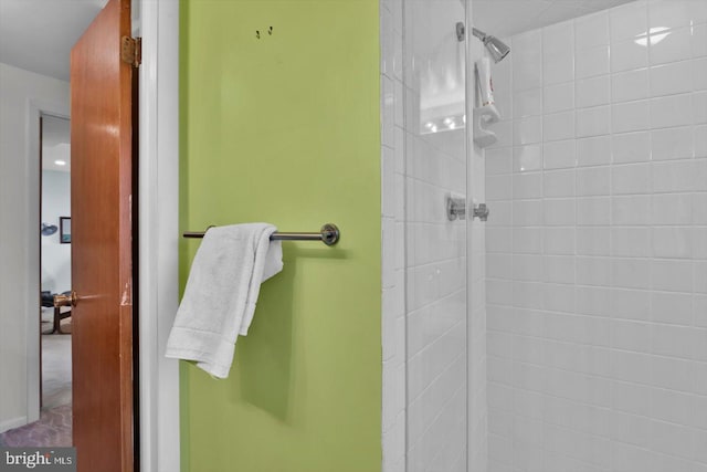 bathroom with a tile shower