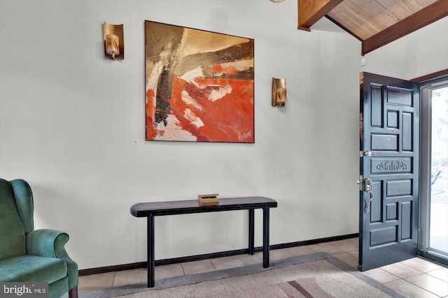 entrance foyer with light tile patterned flooring, wooden ceiling, and vaulted ceiling with beams