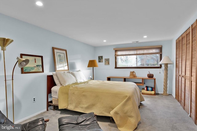 carpeted bedroom with a closet