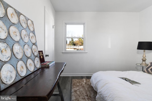 bedroom with hardwood / wood-style flooring