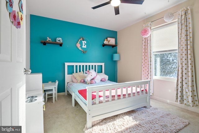 carpeted bedroom with ceiling fan