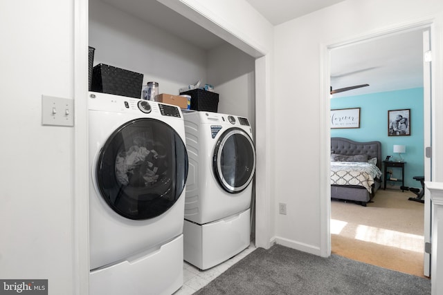 washroom featuring light carpet and separate washer and dryer