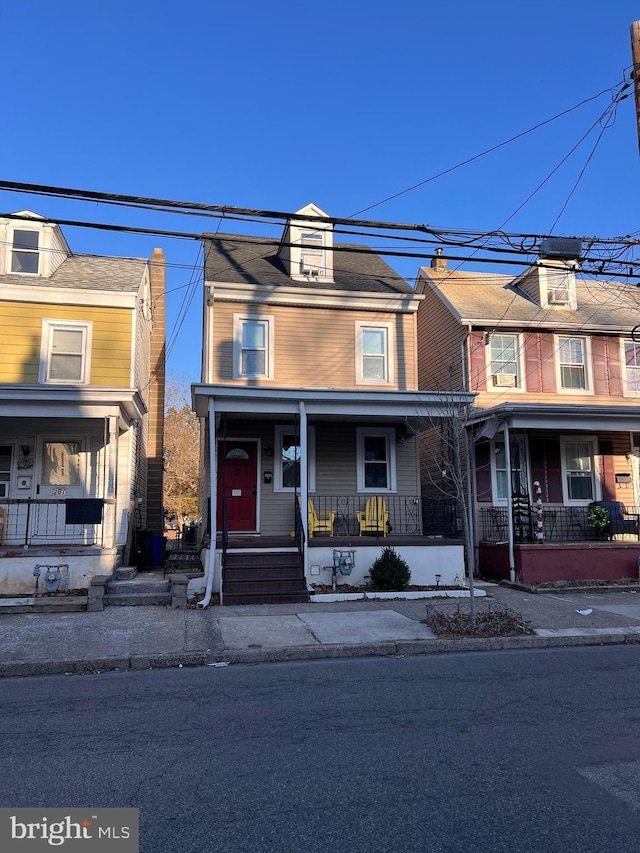 townhome / multi-family property with covered porch