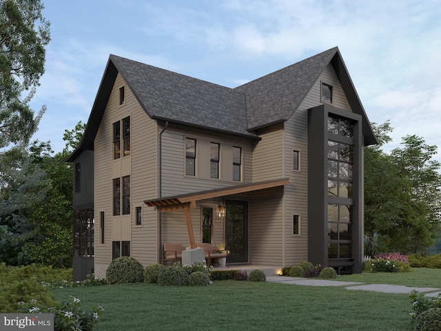 view of front of house featuring a patio and a front yard