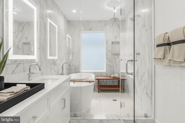 bathroom featuring vanity and separate shower and tub