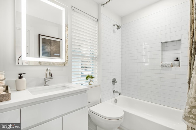 full bathroom featuring toilet, vanity, and shower / bathtub combination with curtain