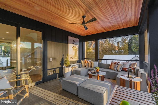 sunroom / solarium with ceiling fan and wooden ceiling