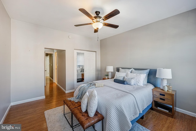 bedroom with dark hardwood / wood-style floors and ceiling fan