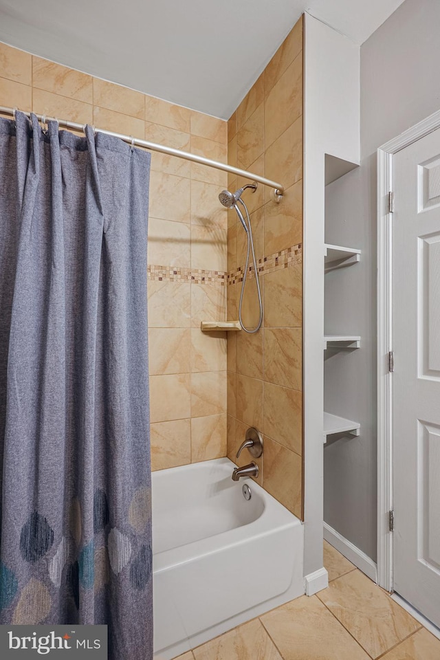 bathroom featuring tile patterned floors and shower / bath combo with shower curtain