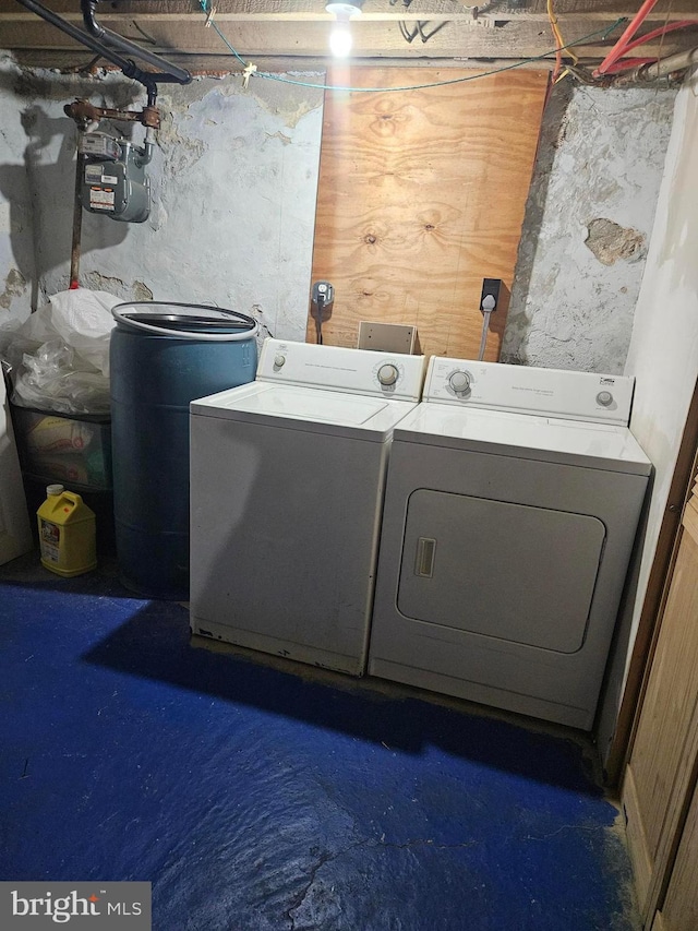 clothes washing area featuring washing machine and dryer