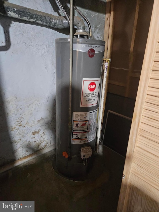 utility room with water heater